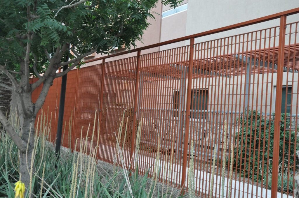 Opus10 Fencing infill with saffron powder coat finish